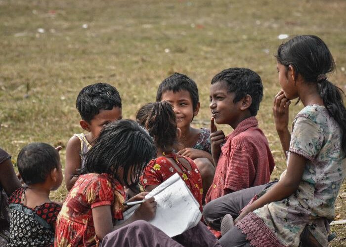 Children sitting together with a book